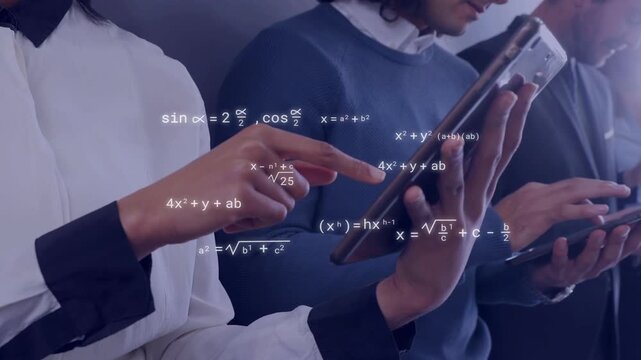 Team of four standing in office and tapping devices, visualizing formulas on screens for analytics