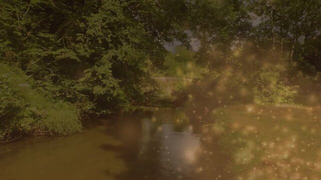 Warm light sparking gold sparkles drifting over river, revealing stone arch bridge and skiff