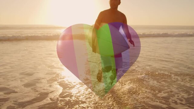Male surfer walking toward shore, finishing surf, carrying board, heart graphic pulsing, marketing