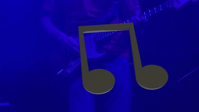Opening chord cueing low framing, player fretting and picking while lights shifting to accent song