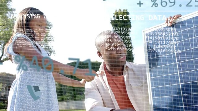 Girl touching shoulder pointing at solar energy panel man holding panel teaching pie charts forming