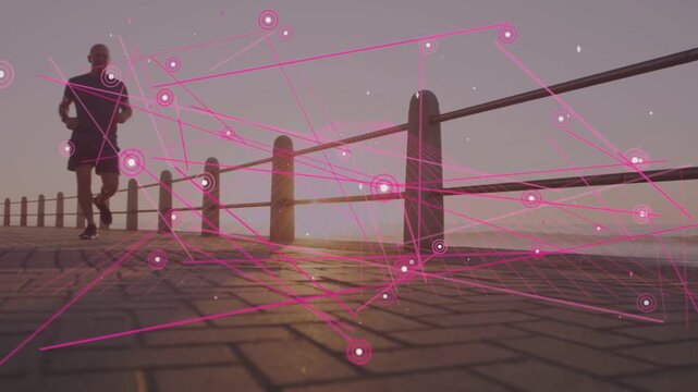 Senior runner jogging from left to camera, sparking pink network around posts along path for health