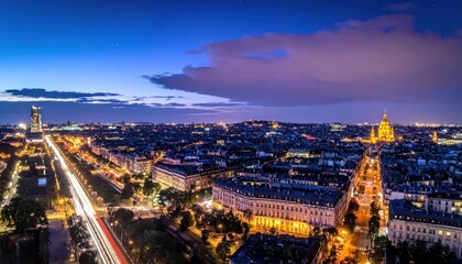 Fototapeta premium City lights twinkle beneath a twilight sky, showcasing boulevards and buildings