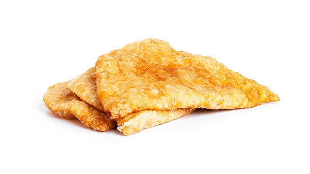 Chebureks are isolated on a white background.