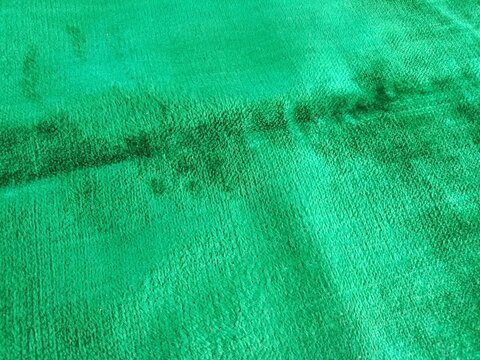 Green Fabric Texture with Dark Seam Line &ndash; Abstract Textile Background Close-Up