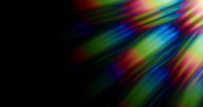 Light shining into a prism creating lens flare in a vivid rainbow of random dancing light rays. Optical effect of a light refraction creating chromatic aberration in a spectrum colors. Loop
