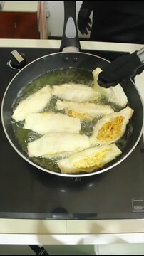 Deep Frying Crispy Stuffed Tofu with Noodles in Sizzling Hot Oil