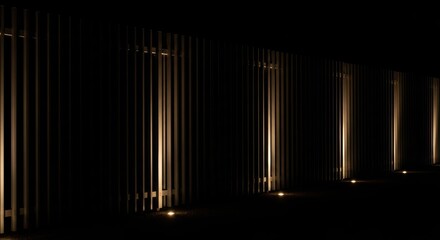 Fototapeta premium Neutral beige concrete wall with refined texture under soft diffused window light displays contemporary design elements with subtle ambient illumination and sleek architectural features.