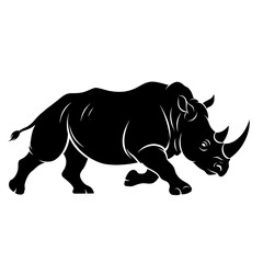Obraz premium Silhouette of a powerful rhinoceros charging forward with its horn prominent.