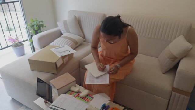 Small business entrepreneur woman managing orders from home