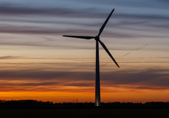 Obraz premium Wind turbine sunset silhouette