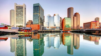 Fototapeta premium City skyline with modern and historic buildings reflected in water