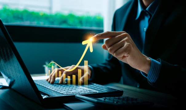 Business growth data analytics financial performance chart with rising arrow on laptop showing investment strategy profit increase and data driven decision making for modern business