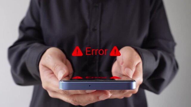 Businesswoman holding her cell phone with an animated "Error" message and warning signs. Warning message indicating a computer error.