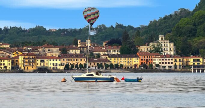  Hot air balloon over Arona on lake Maggiore in Italy.