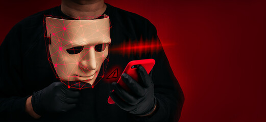 Obraz premium Deepfake identity concept with masked face and facial recognition overlay using smartphone. AI fraud, digital impersonation, voice scam, identity theft, cybercrime risk and biometric security threat.