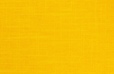 Fototapeta premium Yellow linen fabric cloth texture background, seamless pattern of natural textile.