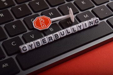 Stop Cyberbullying Message on Keyboard Background