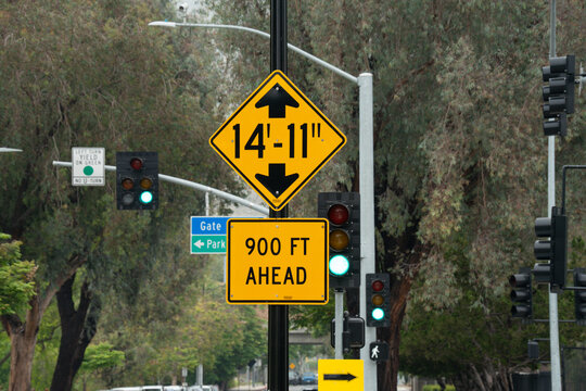 Road signs indicate height restriction and distance ahead