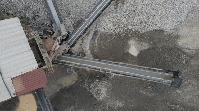 Conveyor Belt System in Quarry Near Rock Crusher Facility, Mining and Material Processing Site view from above