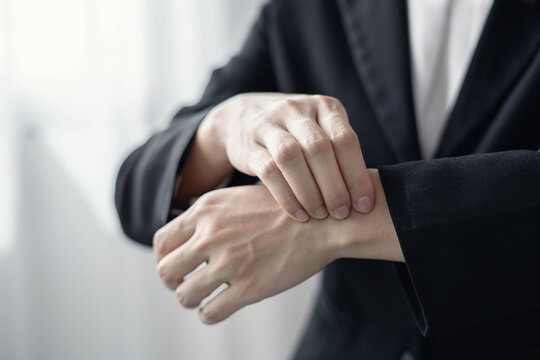 Woman hand with wrist pain numbness and pain in the palm of the hand has pain and tingling in the nerve endings This is a side effect of sitting and working for a long time on a laptop at the office