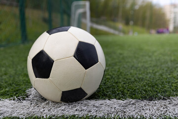Fototapeta premium Soccer ball on soccer field