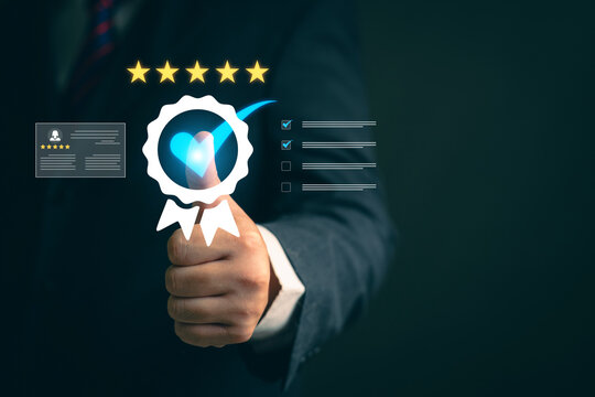 Asia woman using smartphone for select smiley face icon for client evaluation and customer satisfaction after use product and service concept.