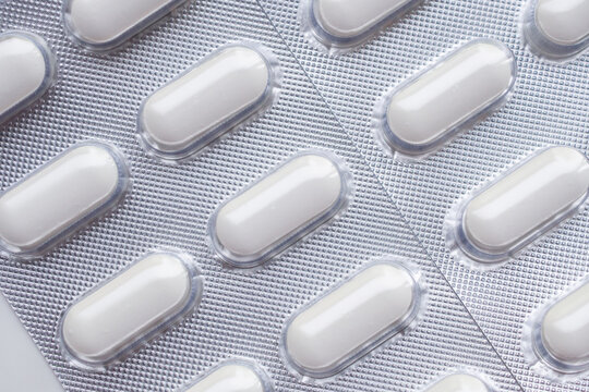 white medicine pills in blister pack close up