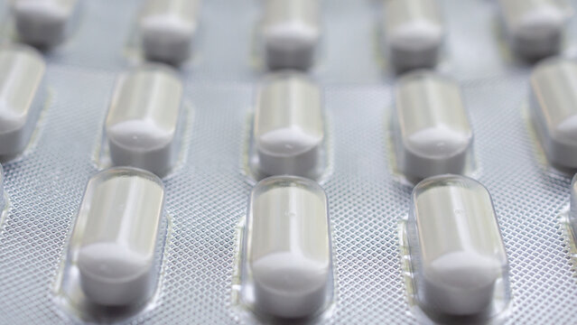 white medicine pills in blister pack close up