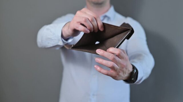 Close-up of an unrecognizable person showing an empty wallet