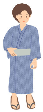 浴衣を着て立つ若い男性