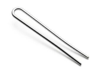 Obraz premium A pair of shiny, metallic hairpins laid out on a white background