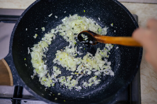 Onion slices caramelizing in hot skillet