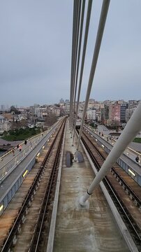 Beautiful aerial footage of the Halic tram passing through Istanbul with iconic mosque architecture in the background. Urban travel scenery with cultural city atmosphere.