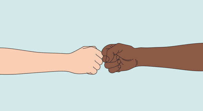 Diverse hands fist bumping, symbolizing unity, friendship, and equality