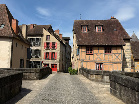 Historic half-timbered houses and stone bridge in Aubusson, Creuse, France