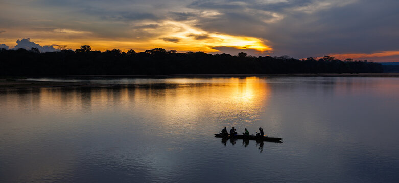 Traditional Fishermen in a Pirogue on the Sangha river near Bayanga village in the early morning, Central African Republic
