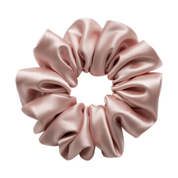 Soft pink silk scrunchie hair accessory with ruffled fabric texture isolated on white background