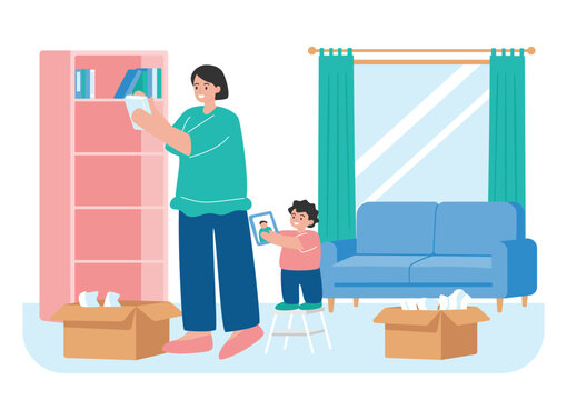 Mother and Young Son Organizing Books and Photos in New Home Living Room