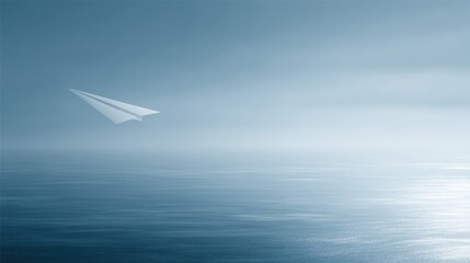 Fototapeta premium Paper airplane flying over ocean, journey and exploration concept, clean composition