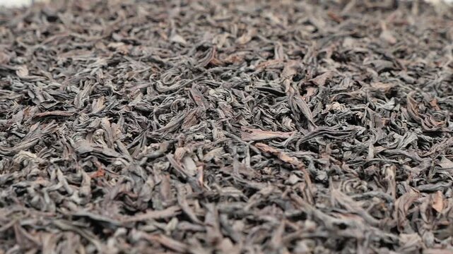 Explore black tea leaves in a market