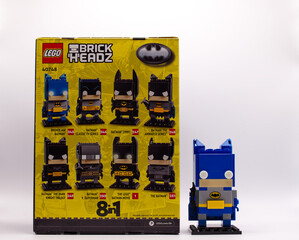 Naklejka premium Bologna - Italy - May 3, 2026: Blue lego brickheadz batman figure standing next to its original eight in one retail box packaging.