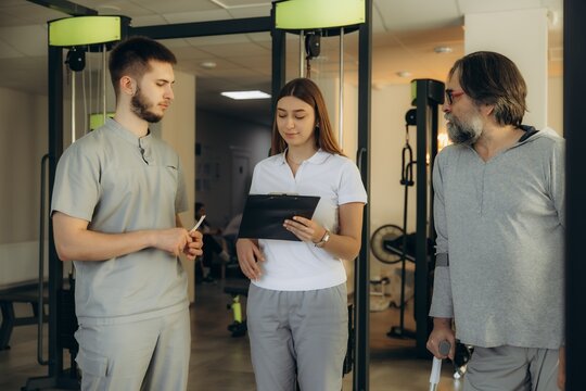 Medical staff consulting patient needing physical therapy