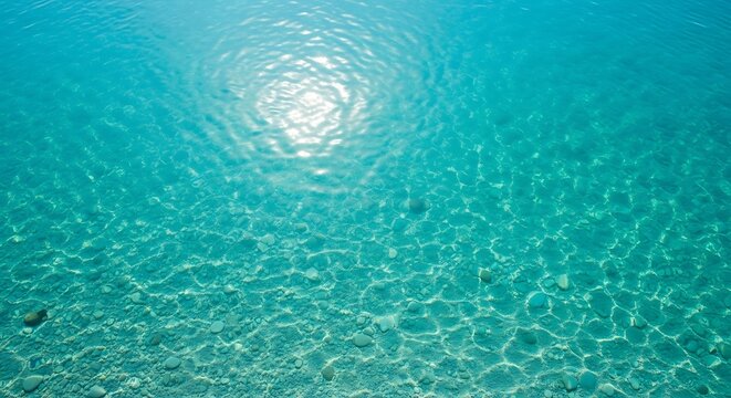 Sunlight Reflections on Clear Turquoise Ocean Water Surface.