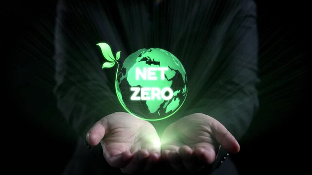 This striking image features hands holding a glowing globe symbolizing the net zero concept, emphasizing sustainability, climate action, and ecological balance in a modern world. Qubit