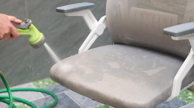 Deep chair cleaning with high-pressure water effectively removes hidden dust from mesh fabric. Strong stream reaches every corner of seat. Professional deep chair cleaning keeps furniture like new