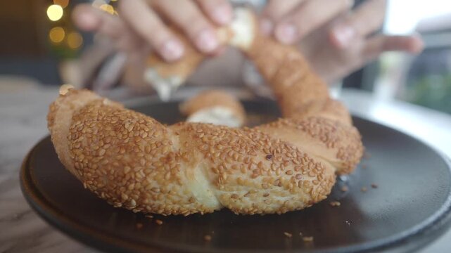 Enjoying simit with tea in a cafe in Istanbul