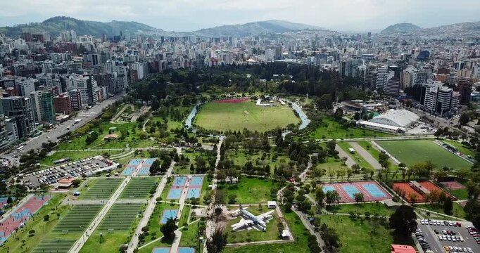 Aerial view of La Carolina Park with sports fields and urban activity in Quito Ecuador