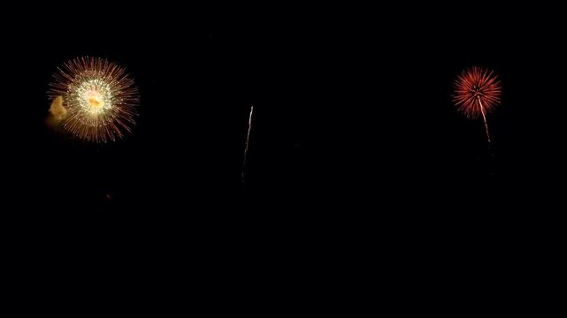 Realistic red firework on black background.
