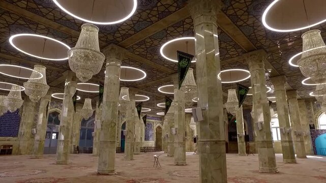  Interior perspective of a mosque with tall marble columns, hanging chandeliers, and a calm prayer hall, conveying spiritual balance, sacred architecture, and peaceful devotion. 